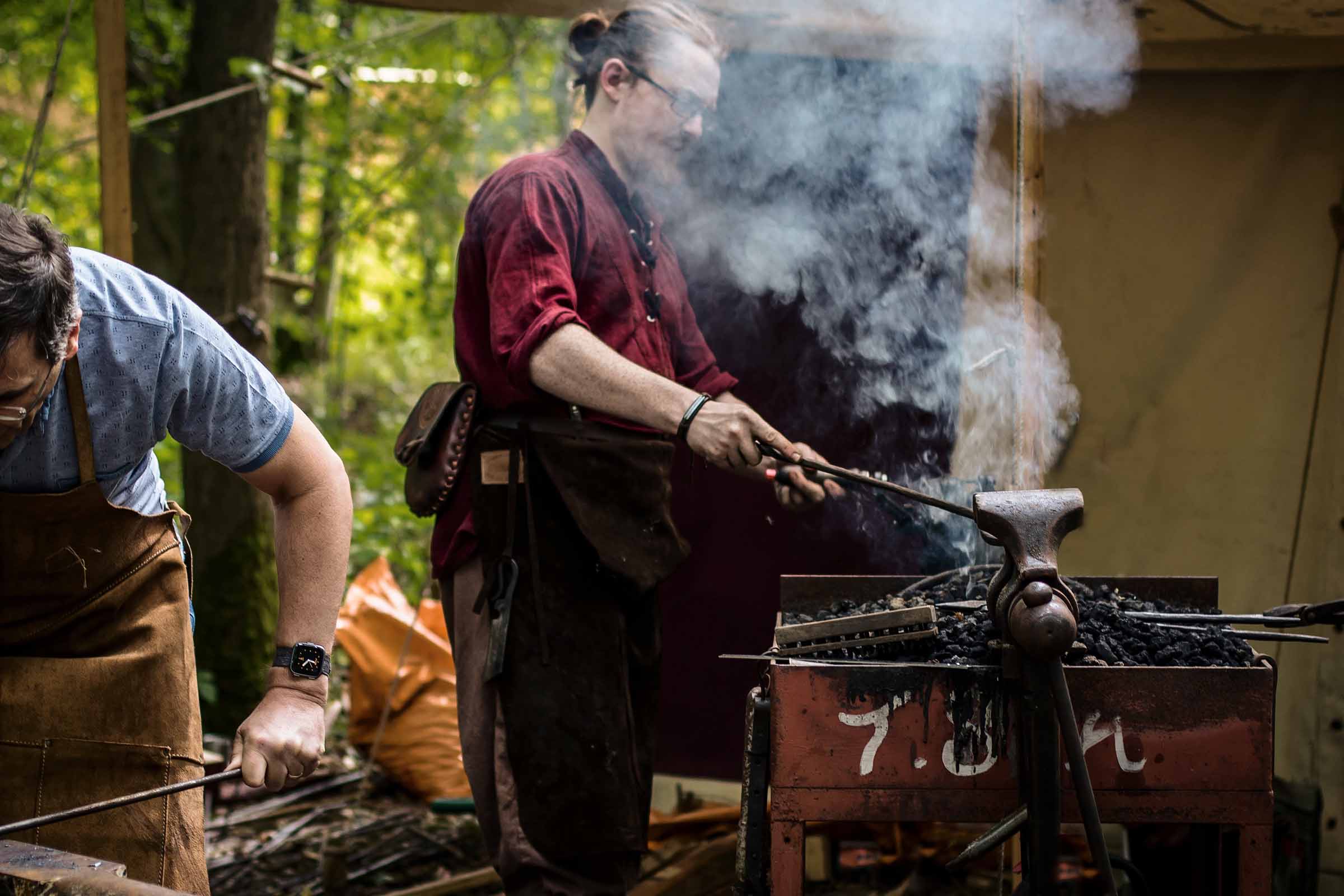 A blacksmith forges steel during a workshop at Loxwood Joust Festival